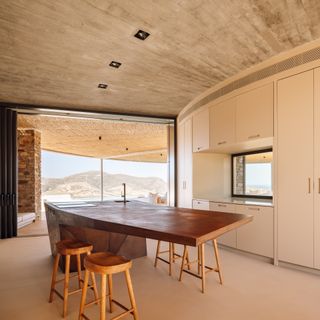 A minimalist kitchen with curved furnishings