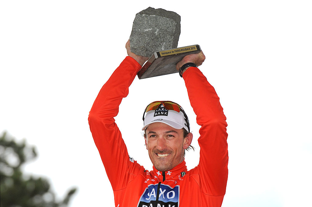Fabian Cancellara celebrates with the cobblestone trophy after the 2010 Paris-Roubaix