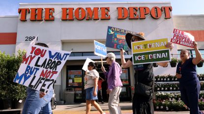 Anti-ICE protesters march outside a Home Depot in Pasadena, California.