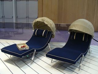 Two black loungers with hoods at the head.