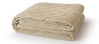 Best weighted blankets: the Saatva Organic Weighted Blanket shown in beige