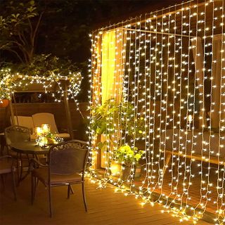 A curtain of string lights on an outside patio