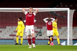 Rob Holding stands dejected as Villarreal beat Arsenal