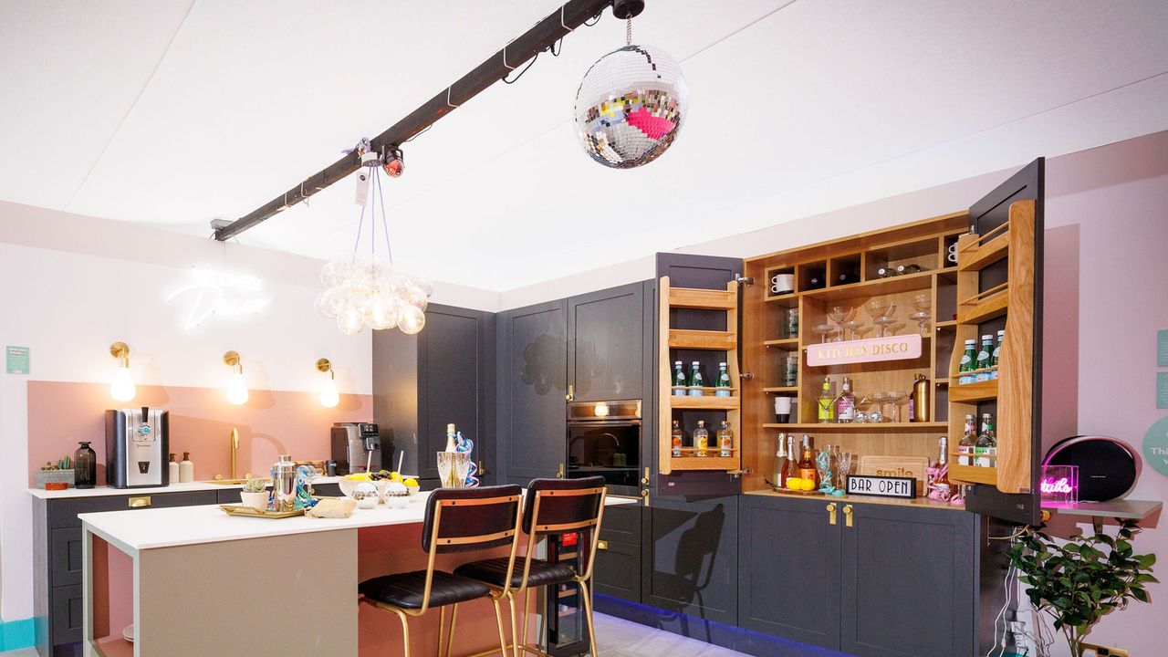 A kitchen with a disco ball and drinks cabinet