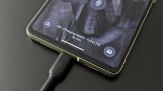 A USB-C charger plugged into the Pixel 7