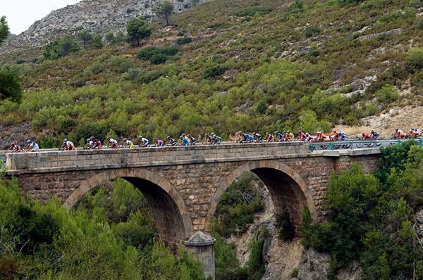Over the bridge the peloton are just specks from this distance