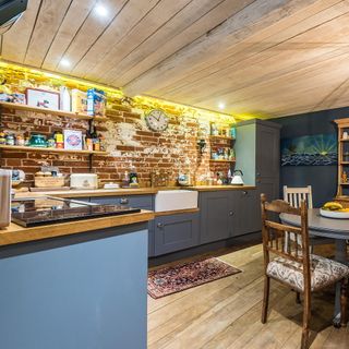 The kitchen of The Stable in Wiltshire with exposed brickwork