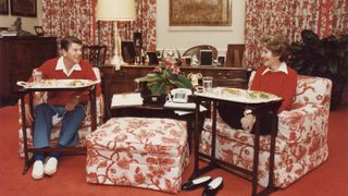 The Reagans dining off of TV trays in the White House, 1981.