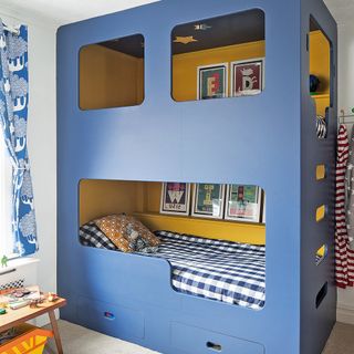 kids room with blue and yellow bunk bed