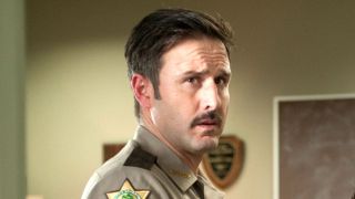 Dewey Riley stares ahead in Scream 4