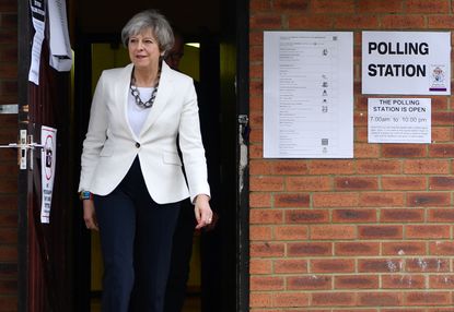 Theresa May leaves a polling station