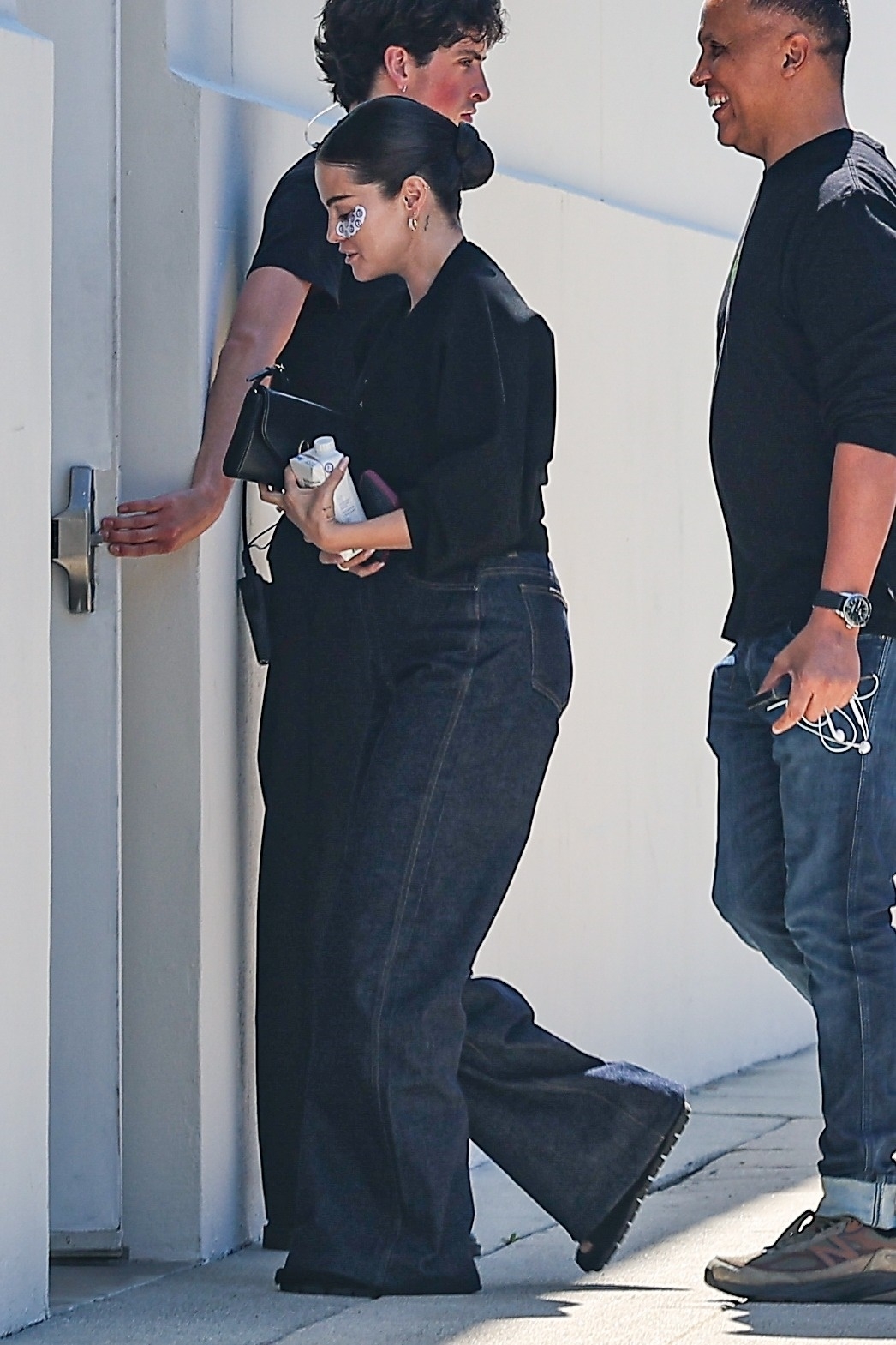 Selena Gomez wore ultra-wide-leg jeans with a cropped black jacket