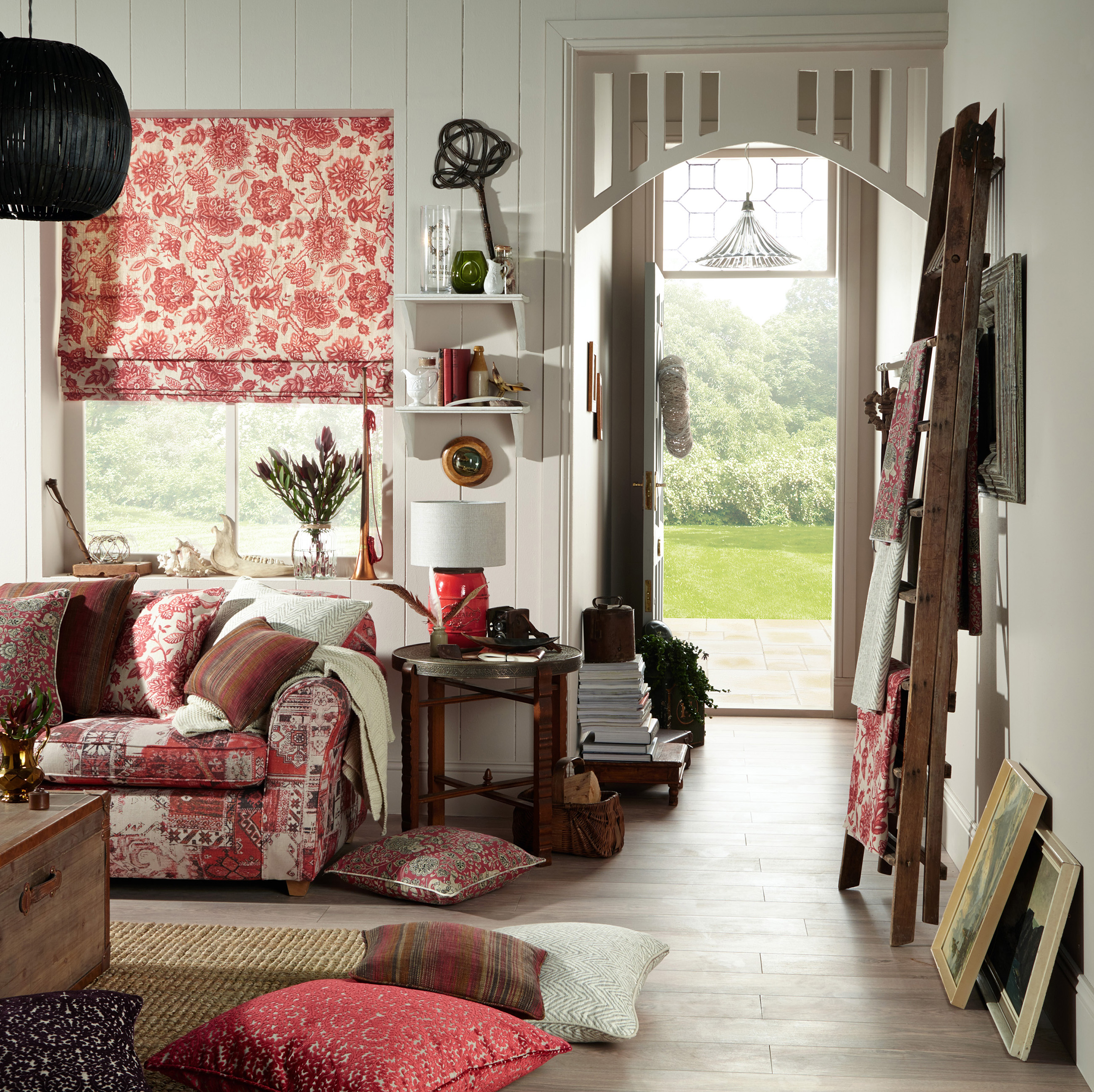 cottage living room with colourful blinds, cushions and sofa