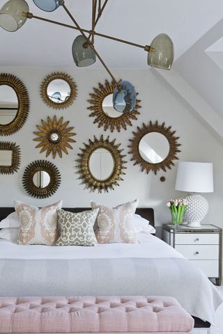 White and pink Bedroom with mirror gallery wall