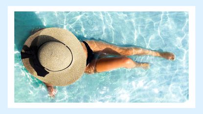 bird&#039;s eye view of woman in swimming pool wearing oversized sunhat