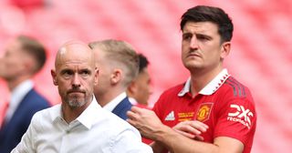 Manchester United manager Erik ten Hag looks dejected with Harry Maguire and Christian Eriksen during the Emirates FA Cup Final match between Manchester City and Manchester United at Wembley Stadium on June 3, 2023 in London, England. 