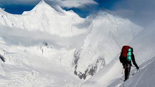 A climber scaling a mountain