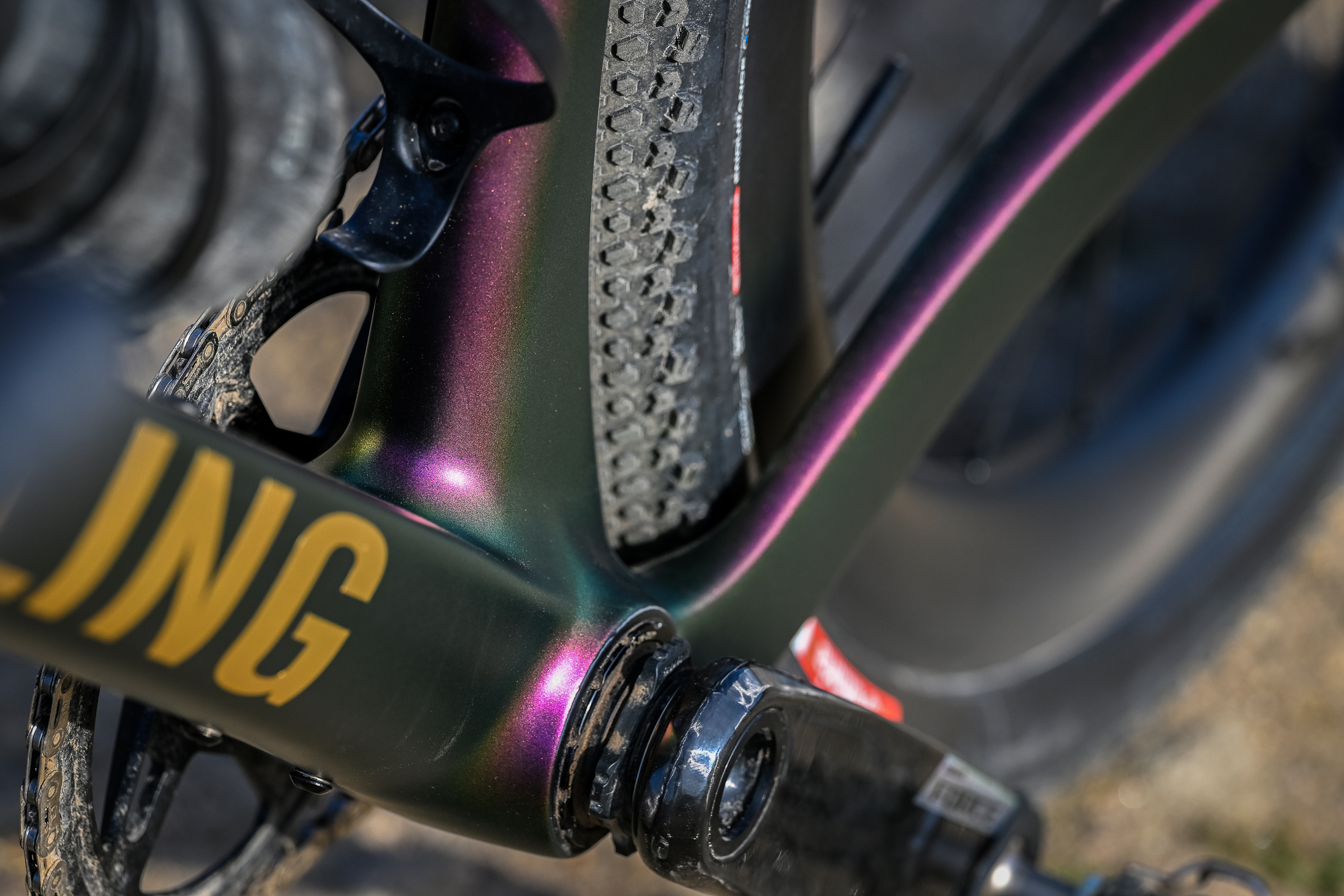 close up of the bottom bracket area of a gravel bike showing the purple paint