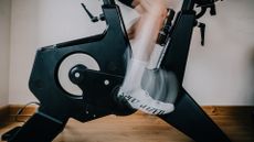 Image shows a rider pedalling at a high cadence/