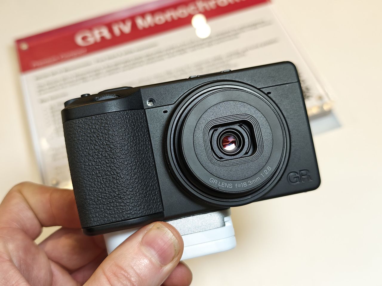 Ricoh GR IV Monochrome in the hand, at the Ricoh stand at The Photography Show 2026