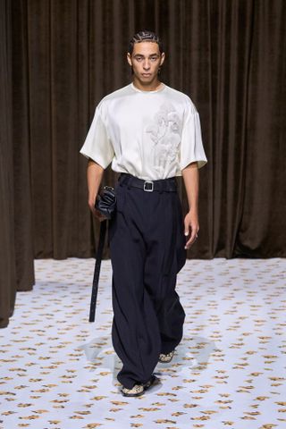 Julez Smith walks the runway at the Jil Sander show during Milan Fashion Week.