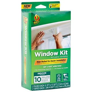 A green cardboard box with an insulating window film kit inside.