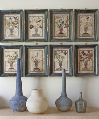 Gallery wall ideas with vintage frames and pressed flower art