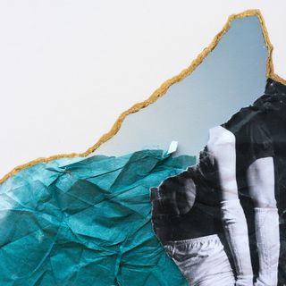 An abstract image of a torn picture. Top left of the photo is a plain white background. bottom left of the phot is a crumpled turquoise paper; and on the right of the photo is the image of 2 faceless people only showing one half of their top half.