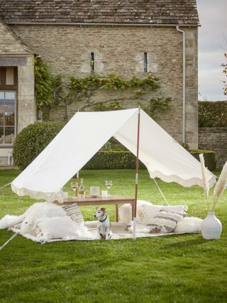 bohemian garden ideas: cox & cox white canopy over seating area