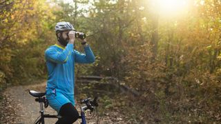 why you should carry binoculars on every adventure: cyclist with bins
