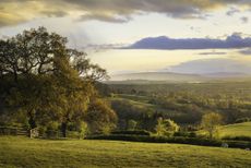 View over Saintbury towards Bredon Hill, Cotswolds, Gloucestershire.