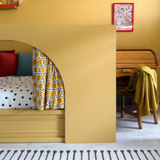 The finished IKEA KURA hack painted in mustard