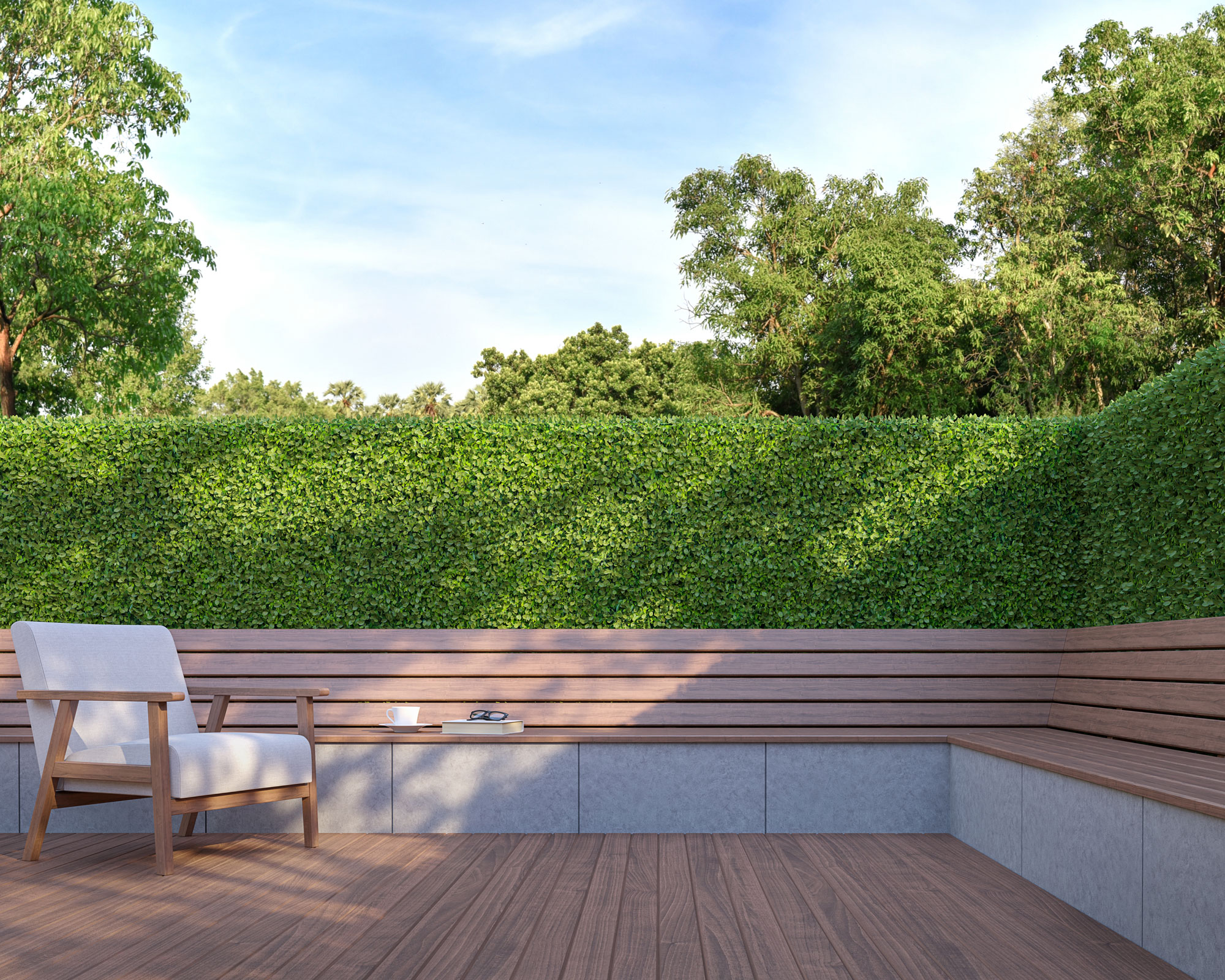 hedge and fence with integrated bench on a deck with outdoor chair