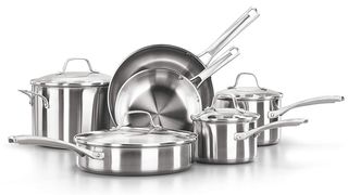 Large set of shiny stainless steel pots & pans.