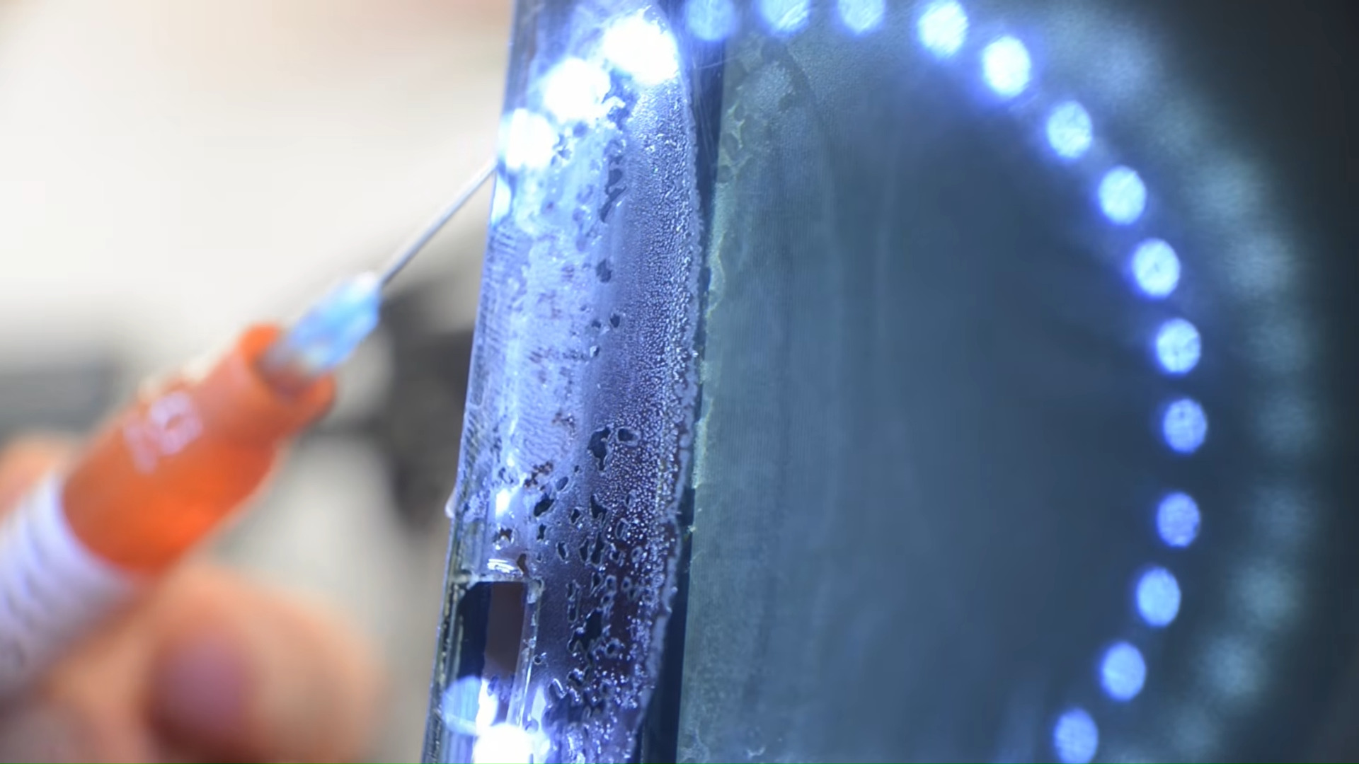 Fixing a vintage 20-inch Trinitron CRT, suffering from cataracts, by injecting UV resin.