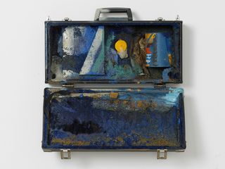 Luggage case filled with paint