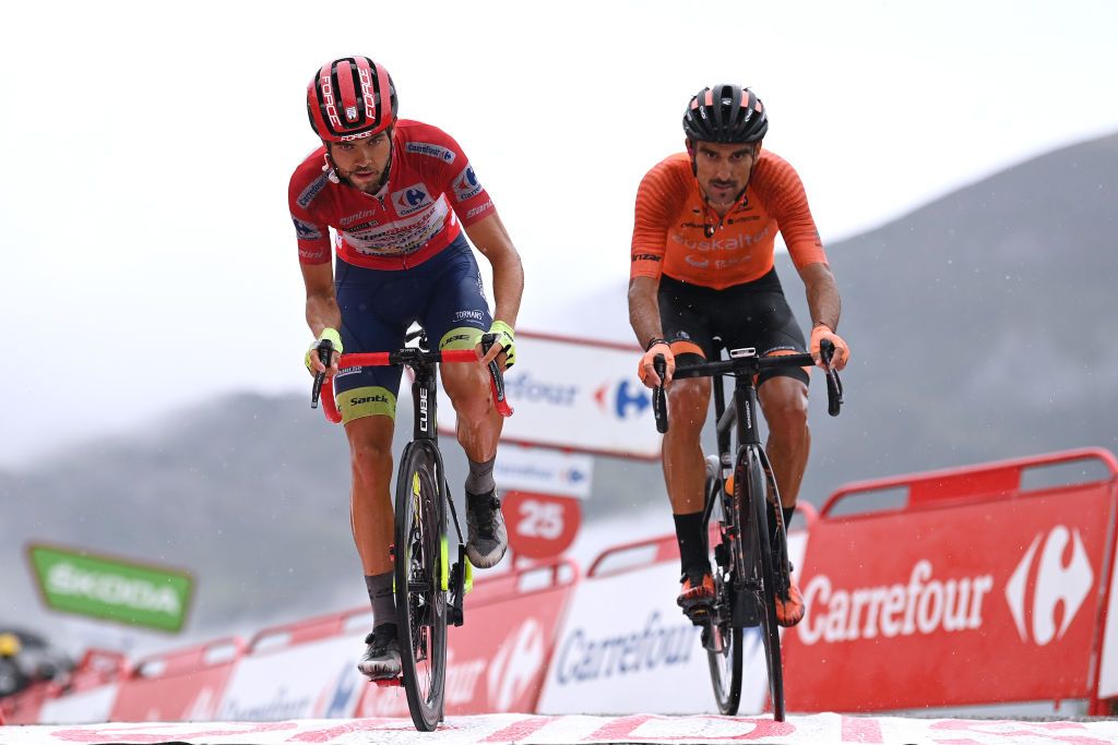 LAGOS DE COVADONGA SPAIN SEPTEMBER 01 LR Odd Christian Eiking of Norway and Team Intermarch Wanty Gobert Matriaux Red Leader Jersey and Luis ngel Mat Mardones of Spain and Team Euskaltel Euskadi cross the finishing line during the 76th Tour of Spain 2021 Stage 17 a 1855km stage from Unquera to Lagos de Covadonga 1085m lavuelta LaVuelta21 on September 01 2021 in Lagos de Covadonga Spain Photo by Stuart FranklinGetty Images