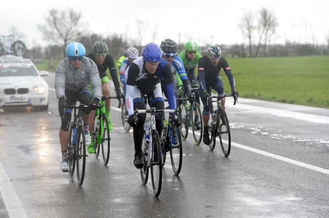 The day's break out ahead of the peloton in the rain and cold