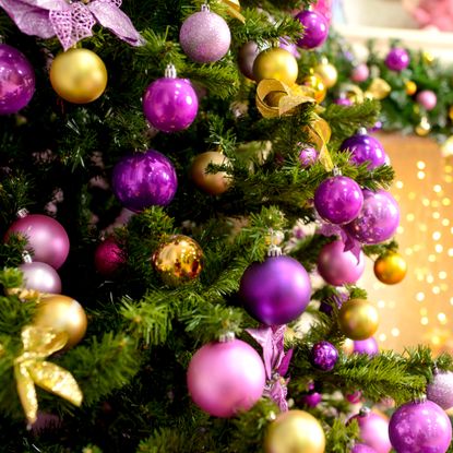 homegrown Christmas tree decorated with pink and gold trim