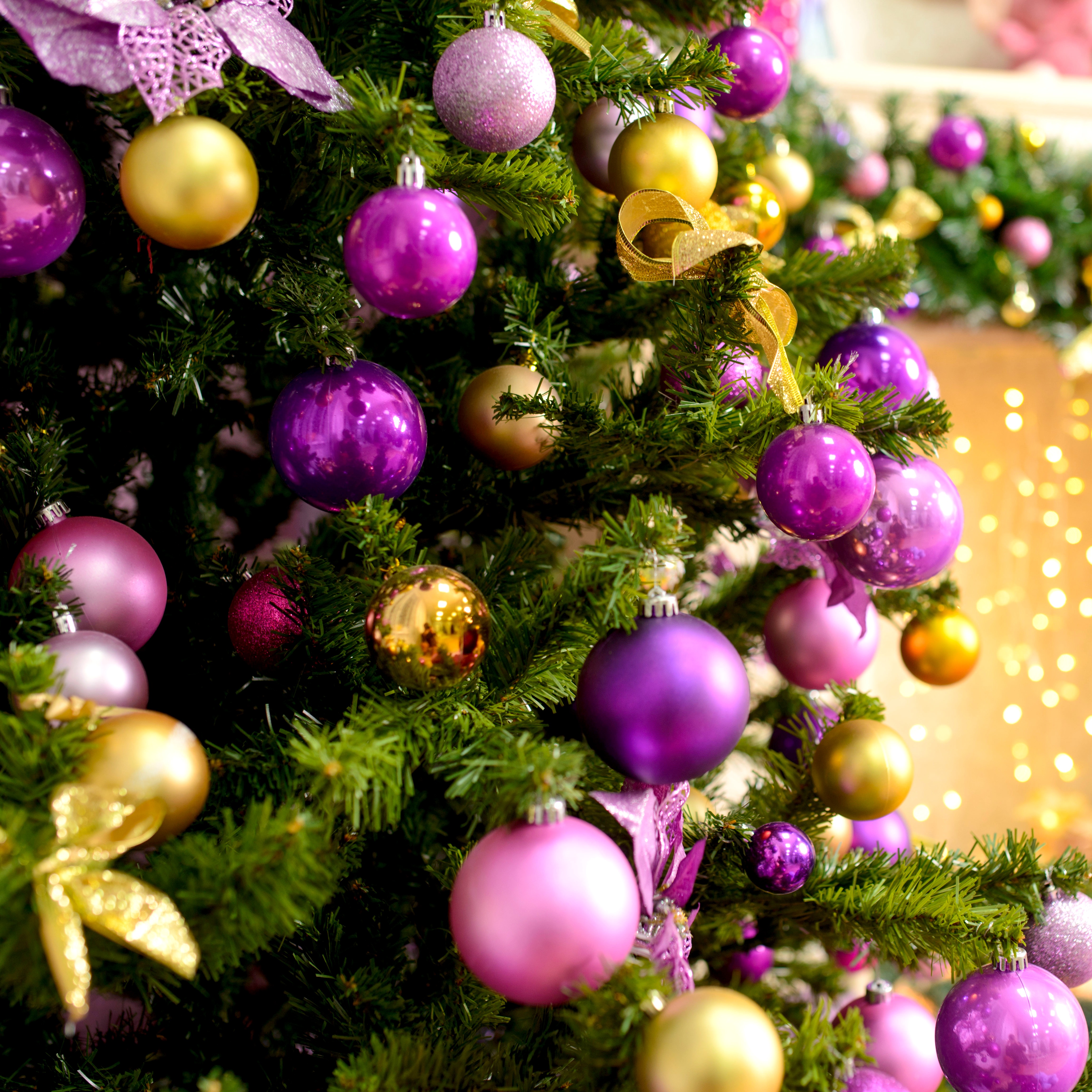 homegrown Christmas tree decorated with pink and gold trim