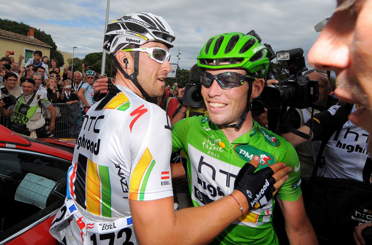 Mark Cavendish and Bernhard Eisel embrace each other at the 2011 Tour