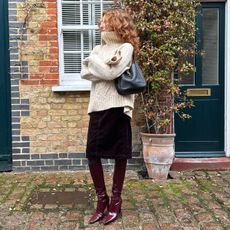 Influencer, street style documenter and TikToker Verona Farell in a winter outfit with YSL boots