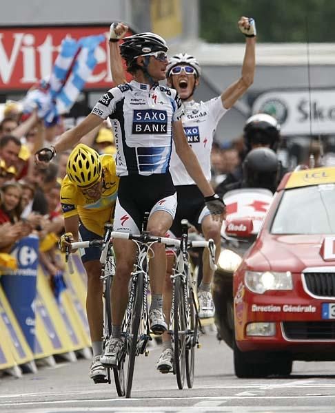 Fr&auml;nk Schleck (Saxo Bank) wins while his brother Andy celebrates behind him.