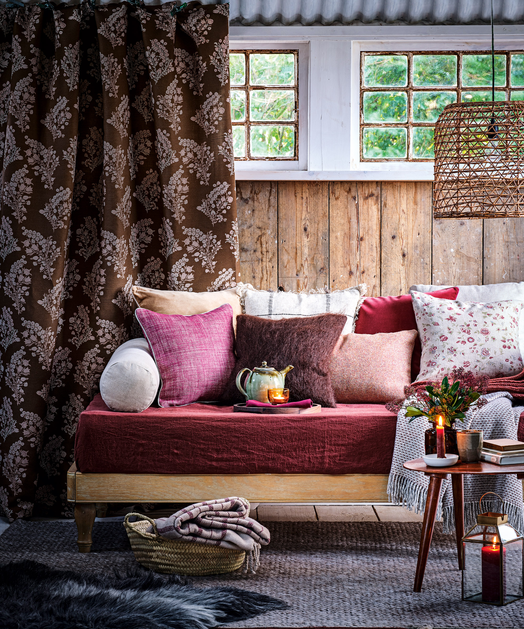 Cozy living room ideas featuring an eclectic mix of warm reds, pinks and browns in a Dan Duchars scheme.