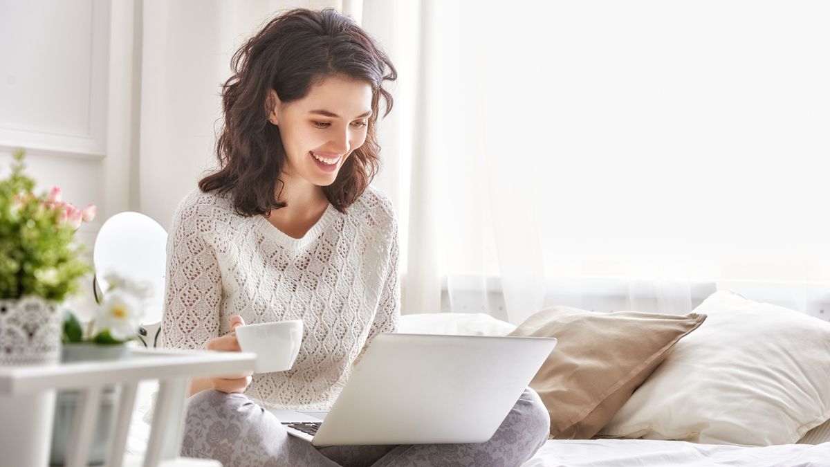 Girl working on her laptop at home