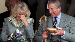 Prince Charles, the Prince of Wales, and his wife Camilla, the Duchess of Cornwall, in their role as the Duke and Duchess of Rothesay, drink whisky from a Quaich given to them a s a wedding gift at the 2005 Mey Games at Queens Park in Mey on August 6, 2005 in Caithness, Scotland. Prince Charles attends smallest games in Scotland near The Castle of Mey, the late Queen Mother's favourite holiday residence. The Duke of Rothesay takes his grandmother's place on the pavilion, having replaced her as honorary chieftain of the games.