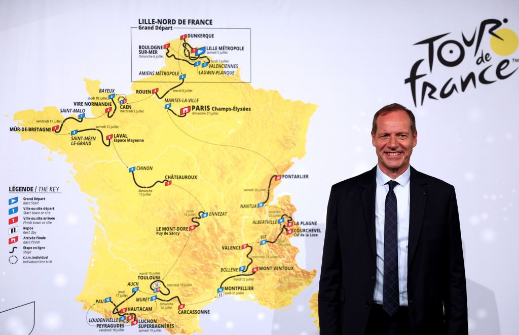 Christian Prudhomme with the 2025 Tour de France route map