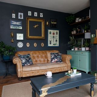 living room with blue wall and wooden flooring with brown sofa with cushions