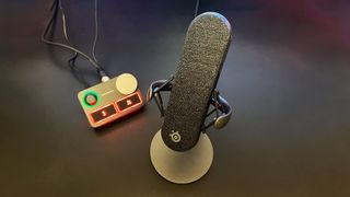 SteelSeries Alias Pro review image of the mic and mixer sitting on a desk