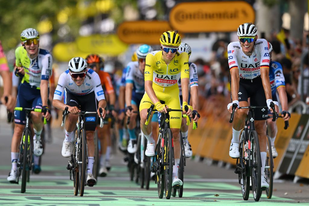 TORINO ITALY JULY 01 LR Remco Evenepoel of Belgium and Team Soudal QuickStep White Best Young Rider Jersey Tadej Pogacar of Slovenia Yellow Leader Jersey and Nils Politt of Germany and UAE Team Emirates cross the finish line during the 111th Tour de France 2024 Stage 3 a 2308km stage from Piacenza to Torino UCIWT on July 01 2024 in Torino Italy Photo by Dario BelingheriGetty Images